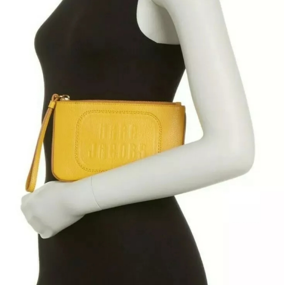 NEW MARC JACOBS THE RETRO LOGO EMBOSSED LEATHER WRISTLEโ Sunflower 5" H x 8" W